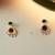 Golden glamour emerald drop antique earrings for women – traditional oxidized silver with green stone & pearl danglers