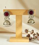 Golden glamour antique jhumka earrings with green stone & pearl detailing