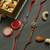 Elegant Stone Rakhi Duo with Kaju Badam, Assorted Chocolates & Dairy Milk – Set of 2