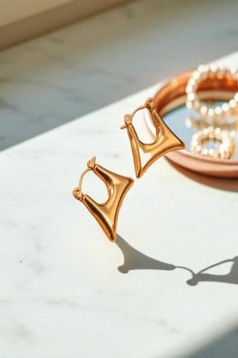 Golden glamouranti tarnish sleek triangle hoop earrings
