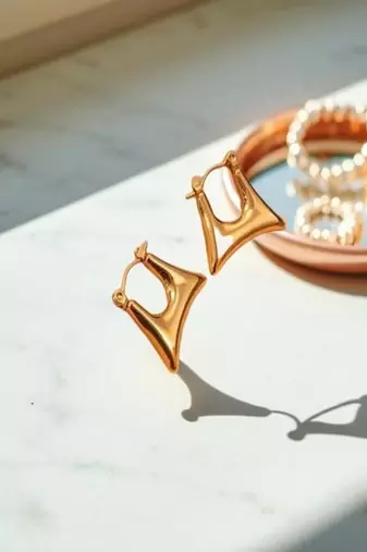 Golden glamouranti tarnish sleek triangle hoop earrings