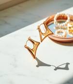 Golden glamouranti tarnish sleek triangle hoop earrings