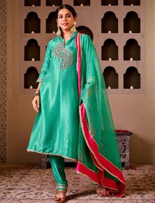 Krishika emerald green silk hand embroidered suit set 1
