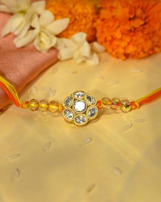 Yellow thread rakhi with floral stone motif and crystal beads 1