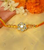 Yellow thread rakhi with floral stone motif and crystal beads
