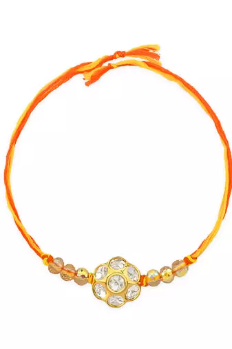 Yellow thread rakhi with floral stone motif and crystal beads