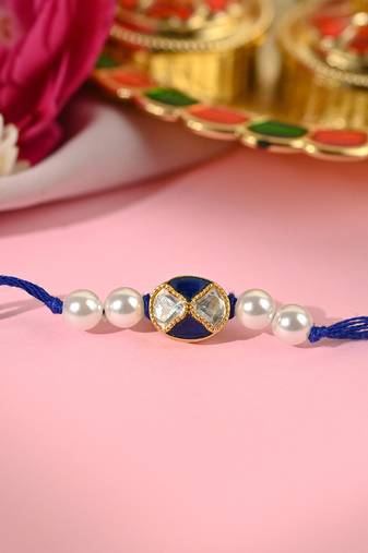 Navy blue thread rakhi with dual stone charm and pearl beads