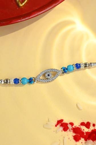 Blue thread evil eye rakhi with sparkling stones and beads