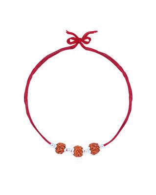 Red thread rakhi with three rudraksha beads and silver accents 2