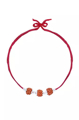 Red thread rakhi with three rudraksha beads and silver accents