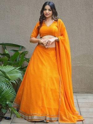 Amazing Orange Laheriya Print Georgette Haldi Wear Lehenga Choli 1