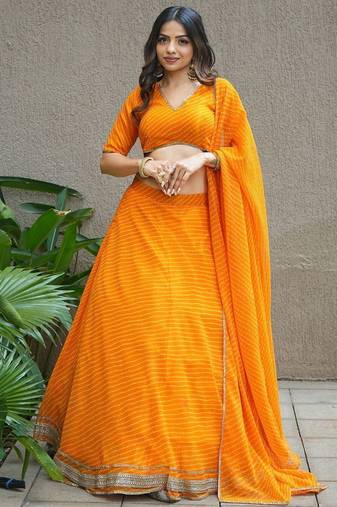 Amazing Orange Laheriya Print Georgette Haldi Wear Lehenga Choli