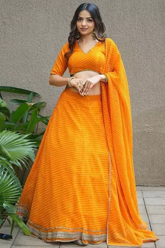 Amazing Orange Laheriya Print Georgette Haldi Wear Lehenga Choli