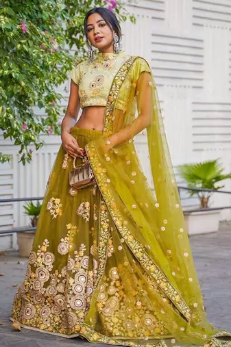 Ravishing Green Mirror Embroidered Net Reception Wear Lehenga Choli