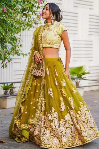 Ravishing Green Mirror Embroidered Net Reception Wear Lehenga Choli