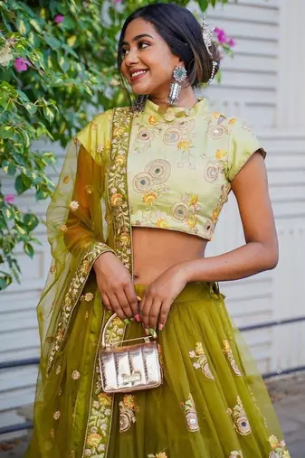 Ravishing Green Mirror Embroidered Net Reception Wear Lehenga Choli