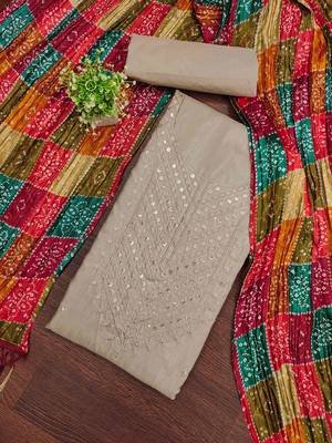 beige cotton dress material with embroidered design 1