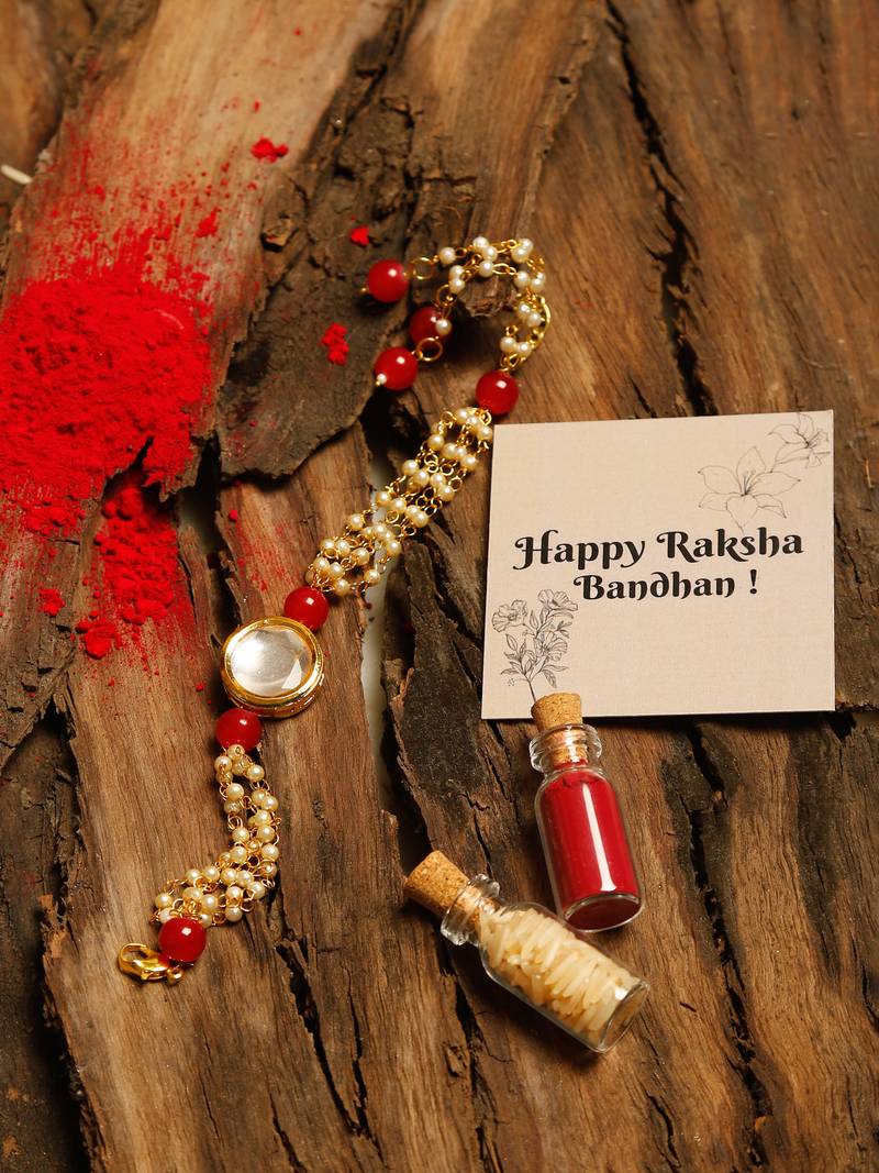 Red stone pearl kundan rakhi