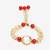 Red stone pearl kundan rakhi