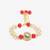 Red stone pearl kundan rakhi