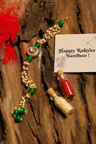 Green stone pearl kundan rakhi