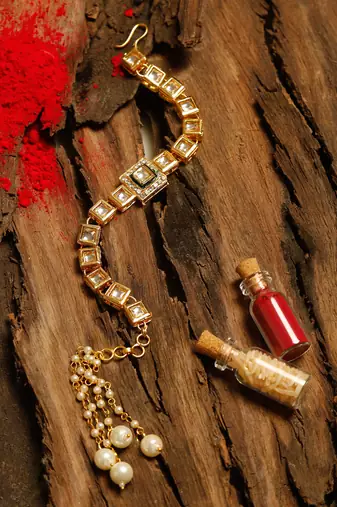 Gold plated silver stone rakhi