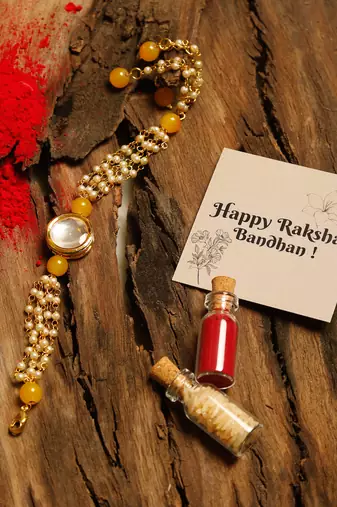 Yellow beaded kundan rakhi