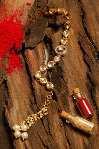 Gold beaded kundan rakhi