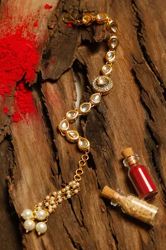 Gold beaded kundan rakhi