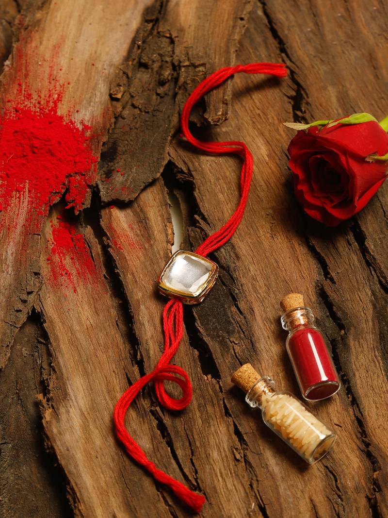 Red thread rakhi with stone