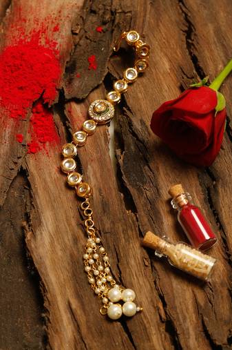 Gold tone kundan rakhi