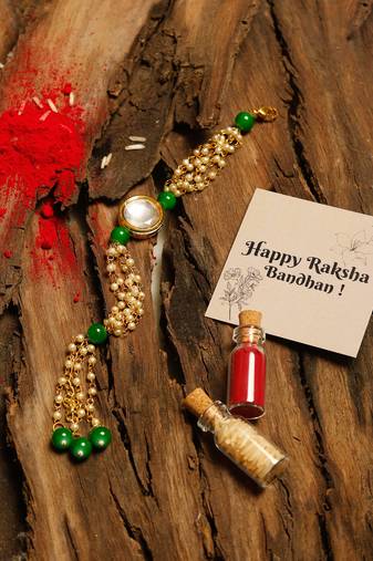 White and green beaded kundan rakhi