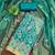 Women's turquoise embroidered dress material