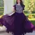 Purple color faux georgette fabric gown crafted with beauds and sequins work
