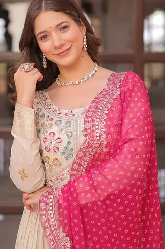 Off white color cosmos jacquard embroidered partywear gown with dupatta