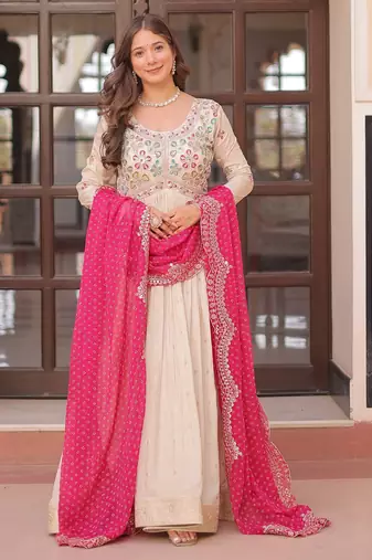 Off white color cosmos jacquard embroidered partywear gown with dupatta