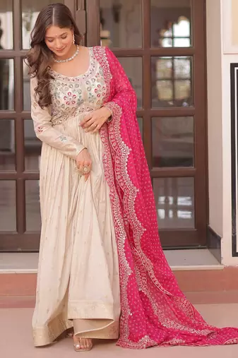 Off white color cosmos jacquard embroidered partywear gown with dupatta
