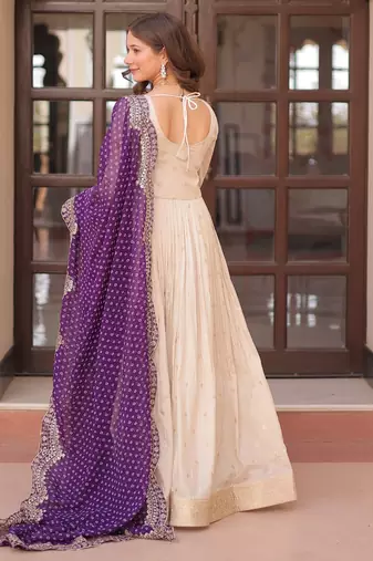 Off white color cosmos jacquard embroidered partywear gown with dupatta