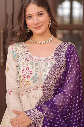 Off white color cosmos jacquard embroidered partywear gown with dupatta