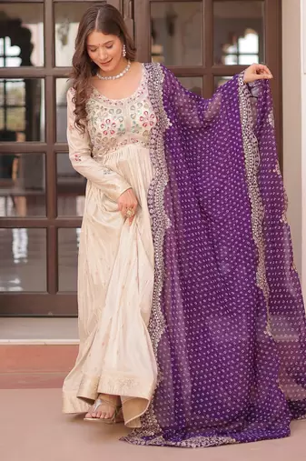 Off white color cosmos jacquard embroidered partywear gown with dupatta