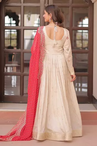 Off white color cosmos jacquard embroidered partywear gown with dupatta