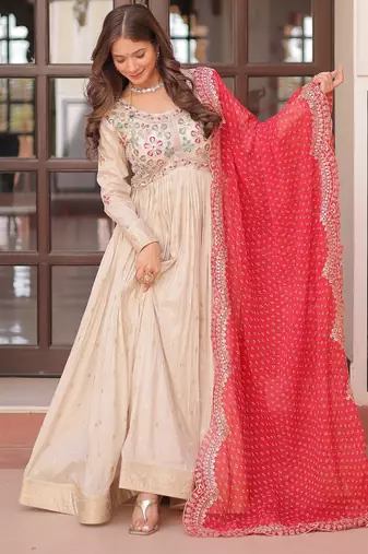 Off white color cosmos jacquard embroidered partywear gown with dupatta