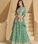 Green color ethnic georgette fabric heavy wedding reception wear ghaghra suit