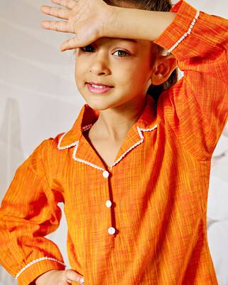 Girl's traditional raksha bandhan outfit - orange cotton kurta with white leggings set for casual festival wear 2