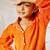 Girl's traditional raksha bandhan outfit - orange cotton kurta with white leggings set for casual festival wear