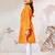 Girl's traditional raksha bandhan outfit - orange cotton kurta with white leggings set for casual festival wear