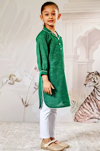 Girl's traditional raksha bandhan outfit - green cotton kurta with white leggings set for casual festival wear