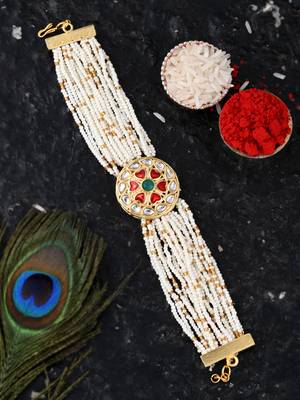 Handcrafted pearl & gold bead rakhi 1