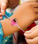 Handcrafted pearl & gold bead rakhi