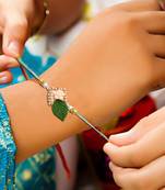 Handcrafted pearl & gold bead rakhi